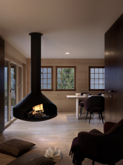 A04 Innenarchitektur Chalet Umbau Interiors Basel Moebeldesign Moebel Cheminee offenes Kamin Monolith schwarz